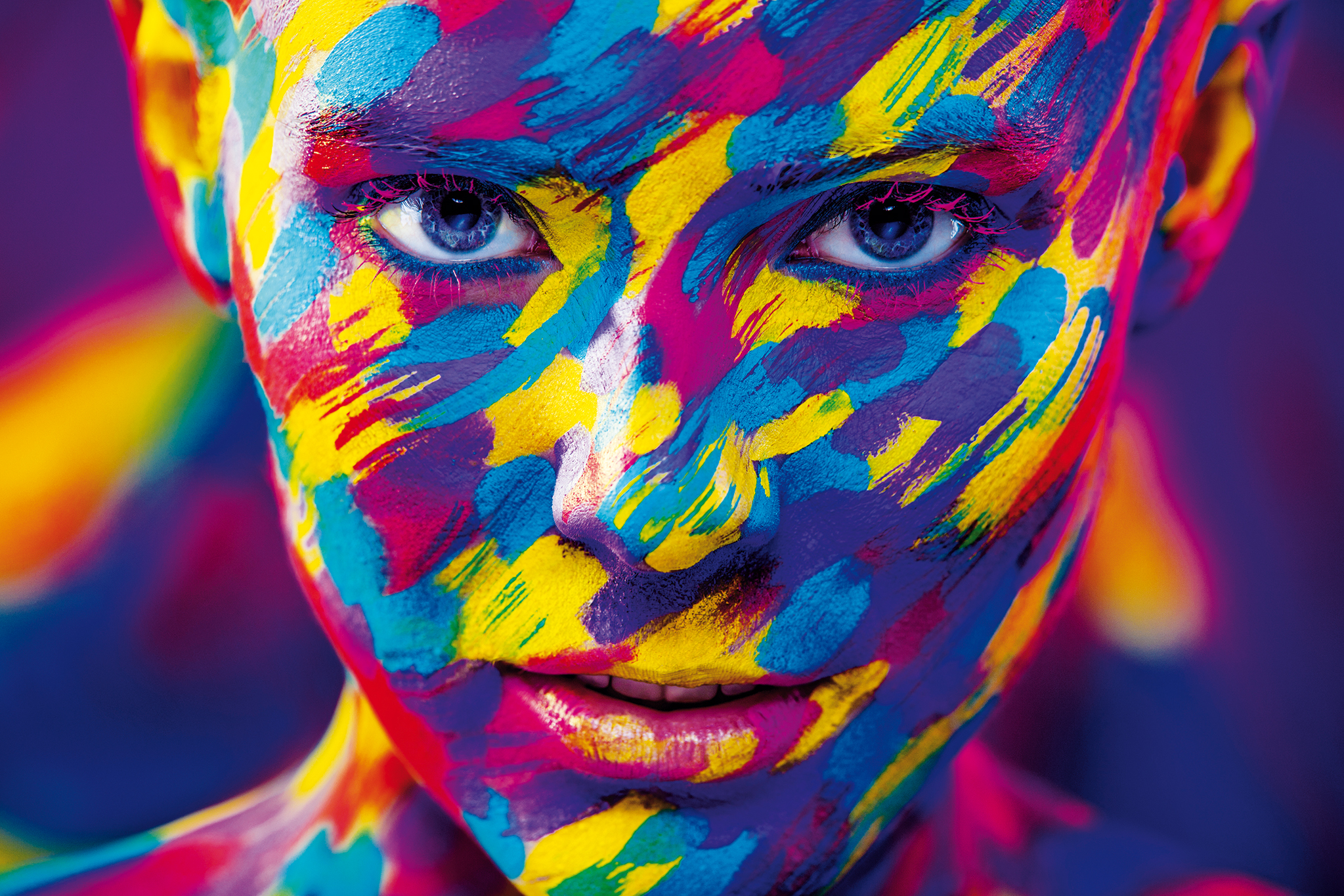 Portrait of the bright beautiful girl with art colorful make-up